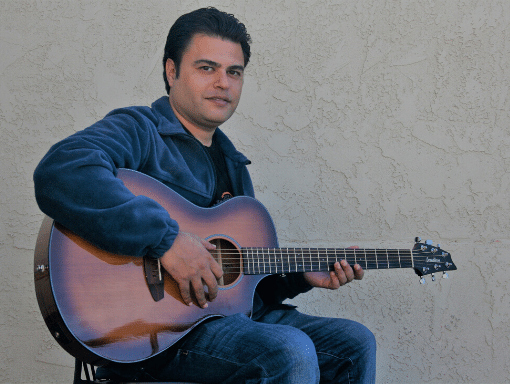 Mighty Mage Sitting With Guitar